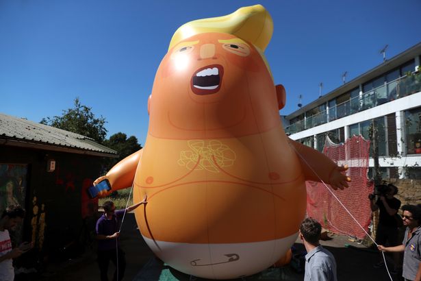People-inflate-a-helium-filled-Donald-Trump-blimp-which-they-hope-to-deploy-during-The-President-of (1).jpg