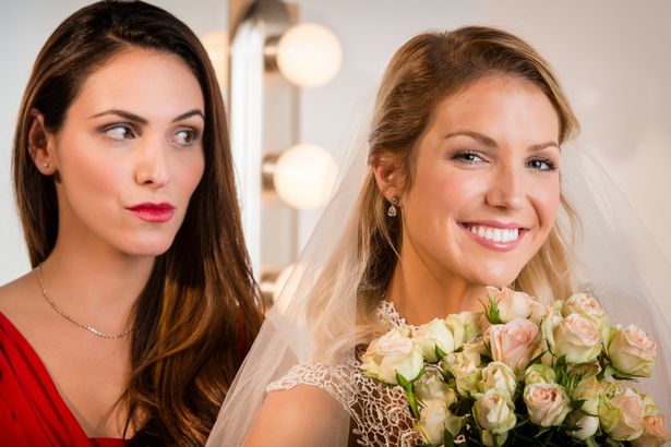 1_Suspicious-bridesmaid-standing-behind-smiling-bride.jpg