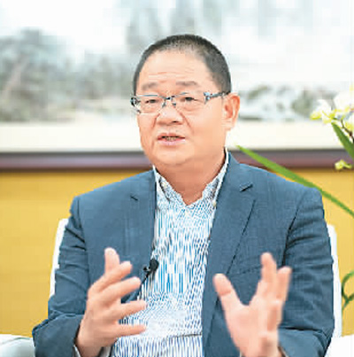 澳门发展离不开“一国两制”(莲花盛开·人物专