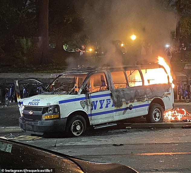 29011480-8372437-A_separate_NYPD_vehicle_pictured_was_set_on_fire_by_demonstrator-a-1_1590936019700.jpg