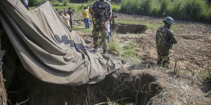 Border Security Force BSF personnel stand near a tunnel originating from Pakistan beneath the Indo-Pak international border fence in J K's Samba district Saturday Aug. 19 2020. Border Security Force BSF personnel stand near a tunnel originating from Pakistan beneath the Indo-Pak international border fence in J K's Samba district Saturday Aug. 19 2020.