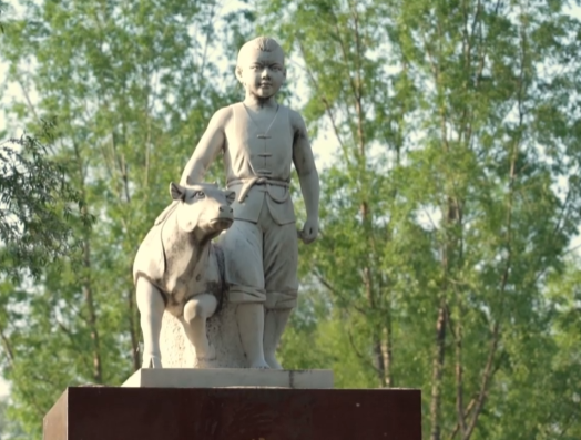 “把这动人的故事传扬”